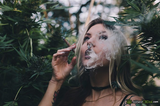 CBD Facts: young woman smoking marijuana CBD Facts: young woman smoking marijuana